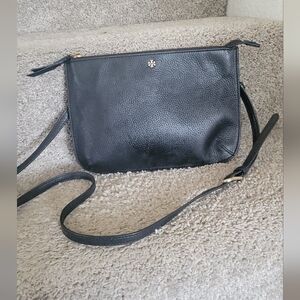 Tory Burch Mercer Pebbled Zip Crossbody Bag in black leather.